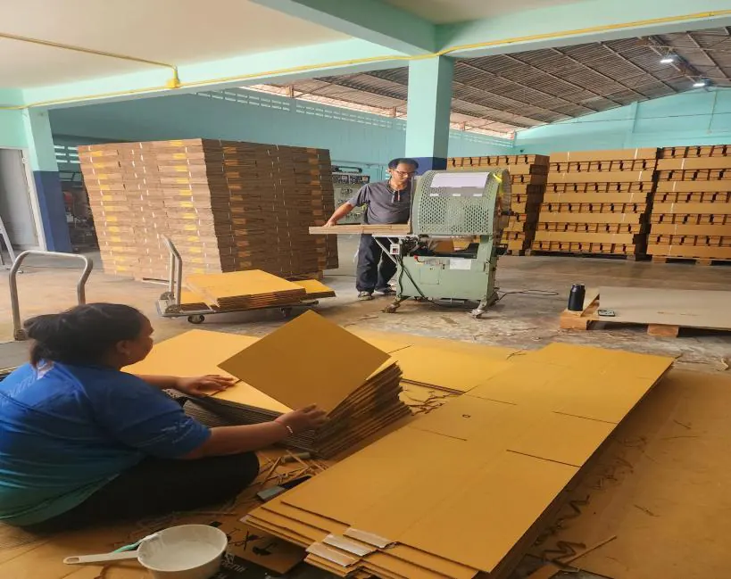 Staff assembling corrugated sheets